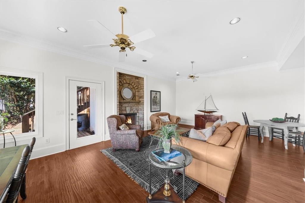 9230 Four Mile Creek Road Gainesville, GA 30506 - Photo 53 of 67 a living room with furniture dining table and wooden floor