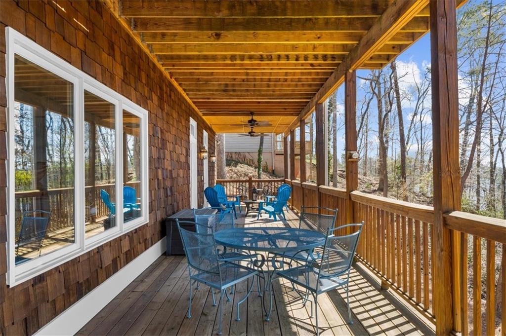 9230 Four Mile Creek Road Gainesville, GA 30506 - Photo 54 of 67 a view of a chairs and table in the balcony