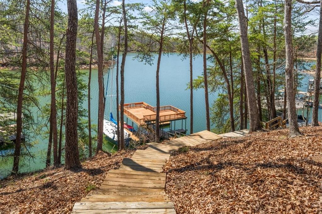 9230 Four Mile Creek Road Gainesville, GA 30506 - Photo 58 of 67 a backyard of a house with table and chairs