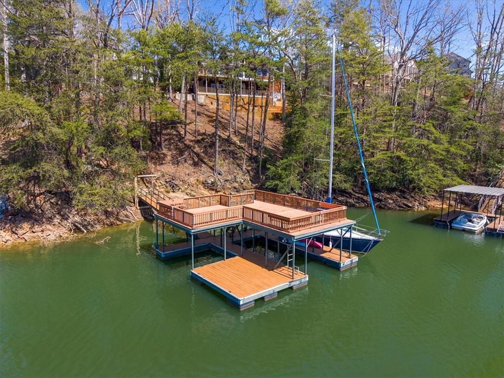 9230 Four Mile Creek Road Gainesville, GA 30506 - Photo 62 of 67 a aerial view of a house with a garden and swimming pool