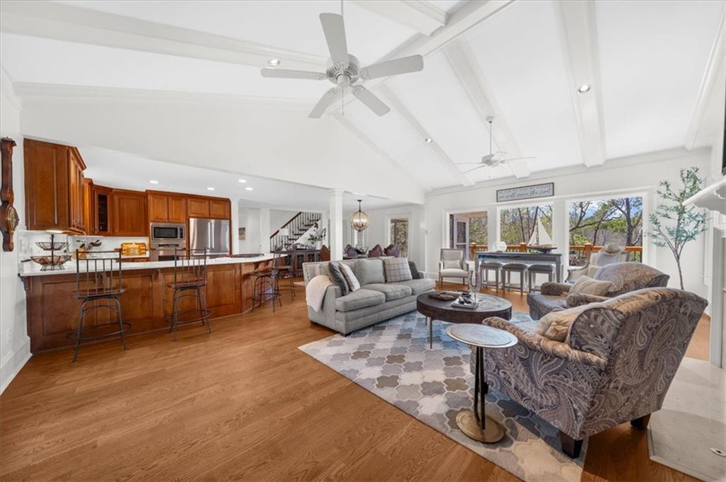 9230 Four Mile Creek Road Gainesville, GA 30506 - Photo 8 of 67 a living room with furniture kitchen view and a large window