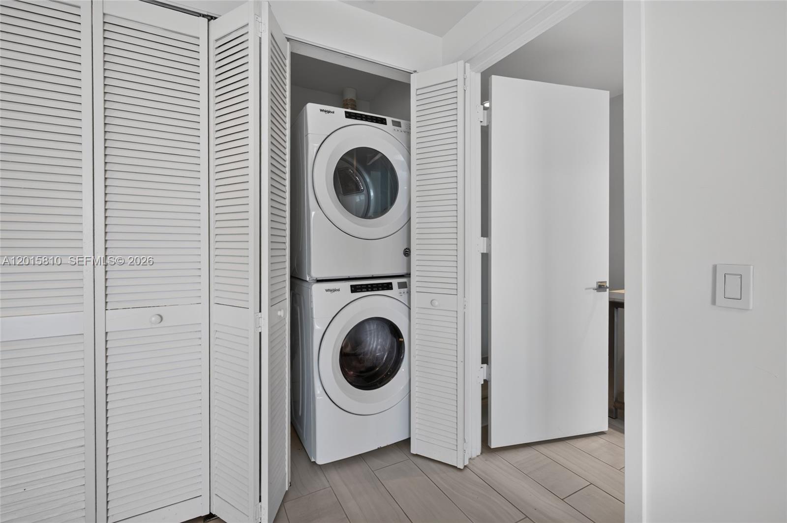 2000 Metropica Way, Unit 1902 Sunrise, FL 33323 - Photo 17 of 40 a utility room with dryer and washer