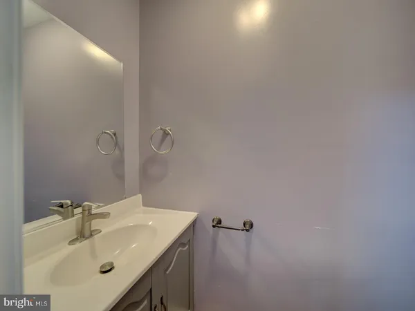 a bathroom with a sink and mirror