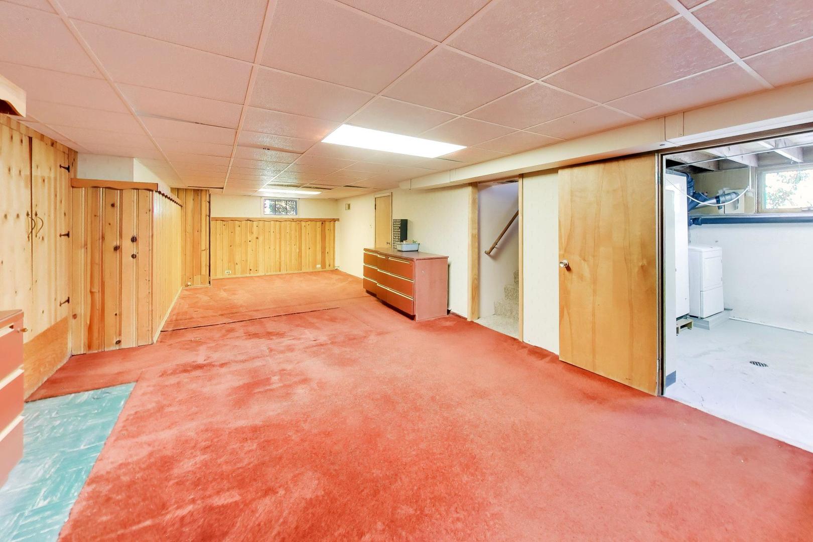 103 Cottonwood Road Northbrook, IL 60062 - Photo 35 of 50 a big room with wooden cabinet and windows