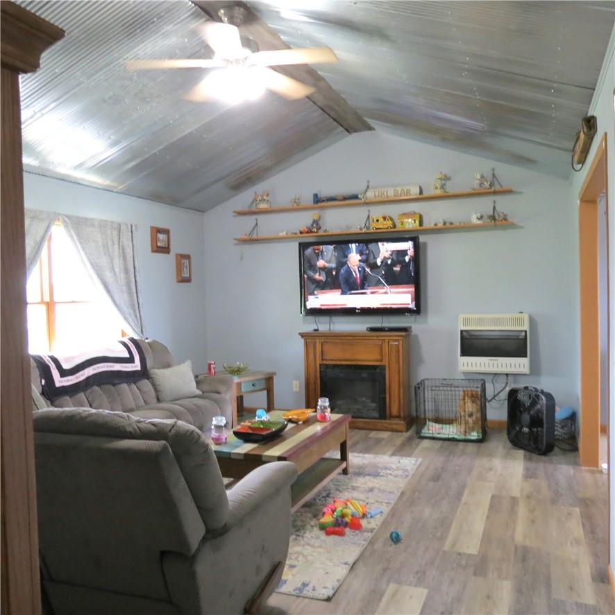 21242 Dingman-Slagle Road Pemberton, OH 45353 - Photo 5 of 33 This inviting living area features unique vaulted ceilings and comfortable spaces perfect for relaxation.