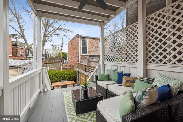 a view of balcony with furniture