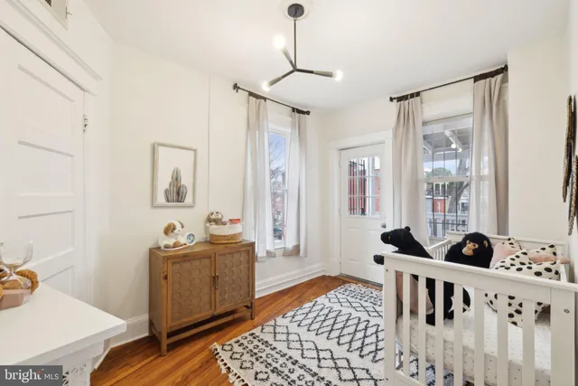 a bedroom with furniture and window