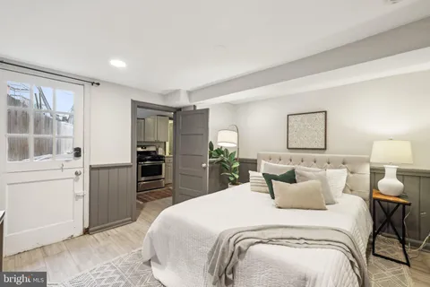 a bedroom with a bed and a dresser