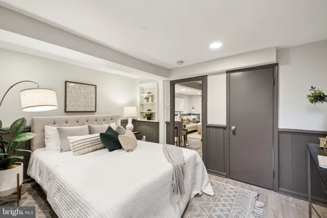 a bedroom with a bed and a lamp