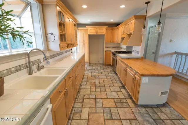 a bathroom with a sink a mirror and a bathtub