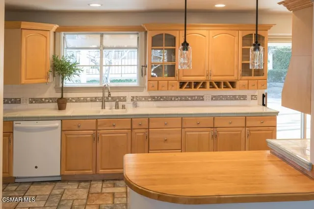 a bathroom with a sink a vanity and a mirror