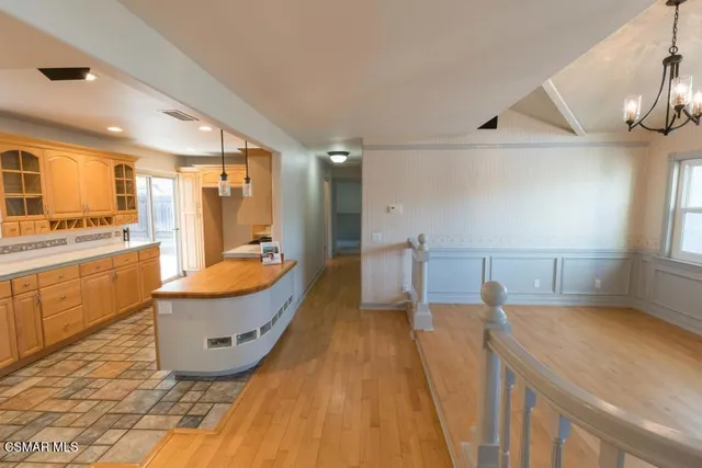 a large bathroom with a sink a large mirror and a bathtub