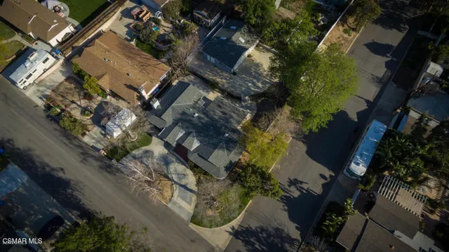 an aerial view of a residential houses with outdoor space