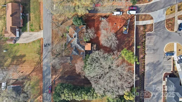 a aerial view of a house with a yard