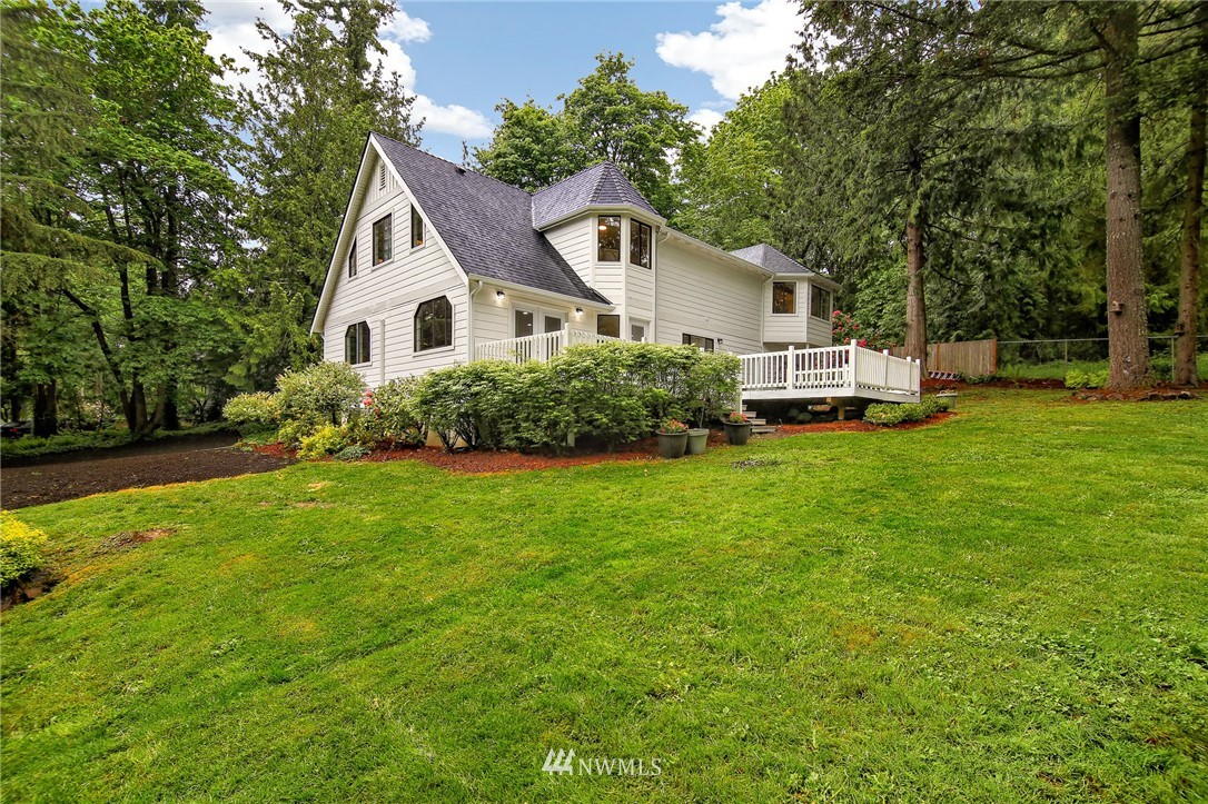 28505 Northeast Tolt Hill Road Carnation, WA 98014 - Photo 2 of 25 a front view of house with yard and green space