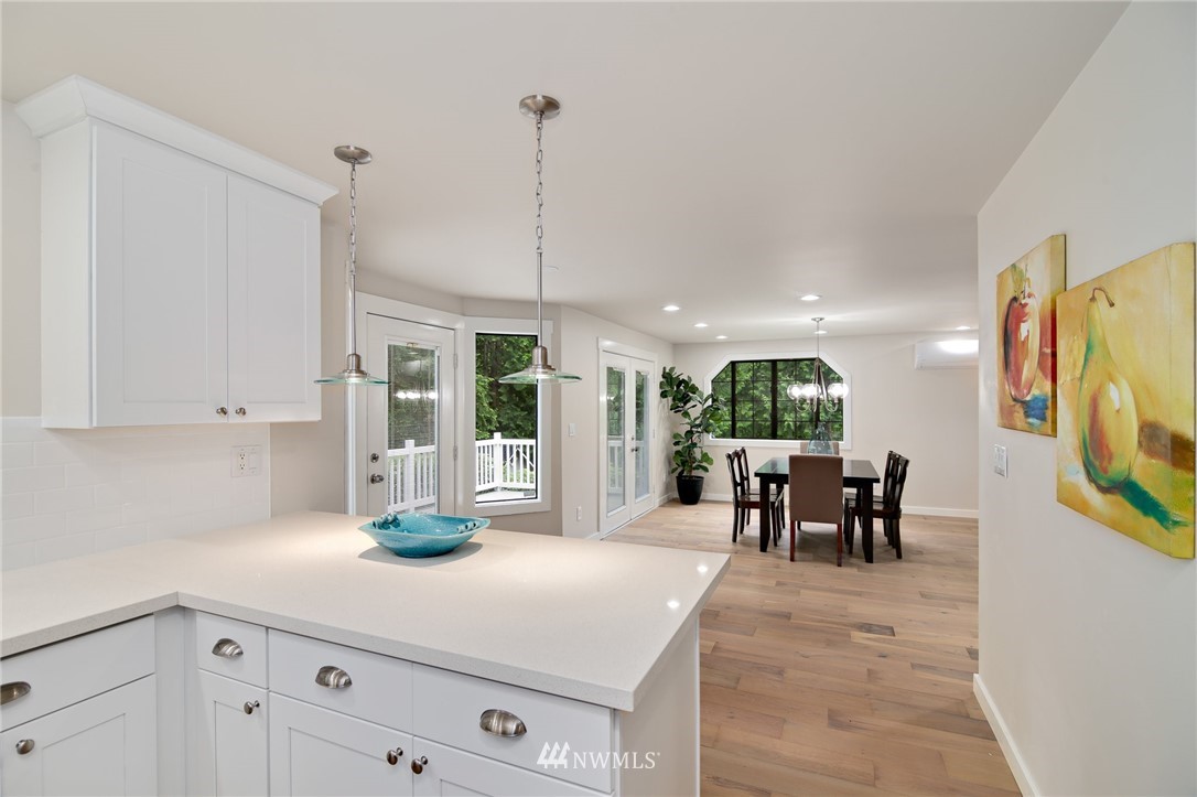 28505 Northeast Tolt Hill Road Carnation, WA 98014 - Photo 14 of 25 a kitchen with stainless steel appliances granite countertop a sink a stove and a wooden floors