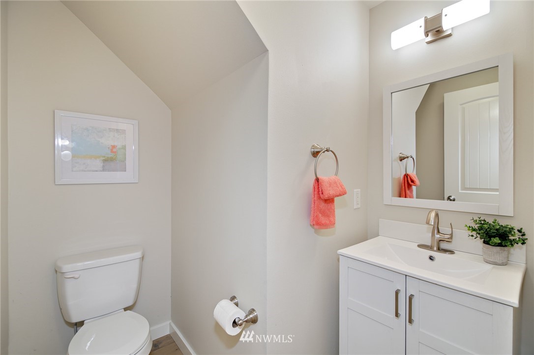 28505 Northeast Tolt Hill Road Carnation, WA 98014 - Photo 15 of 25 a bathroom with a toilet sink vanity and mirror