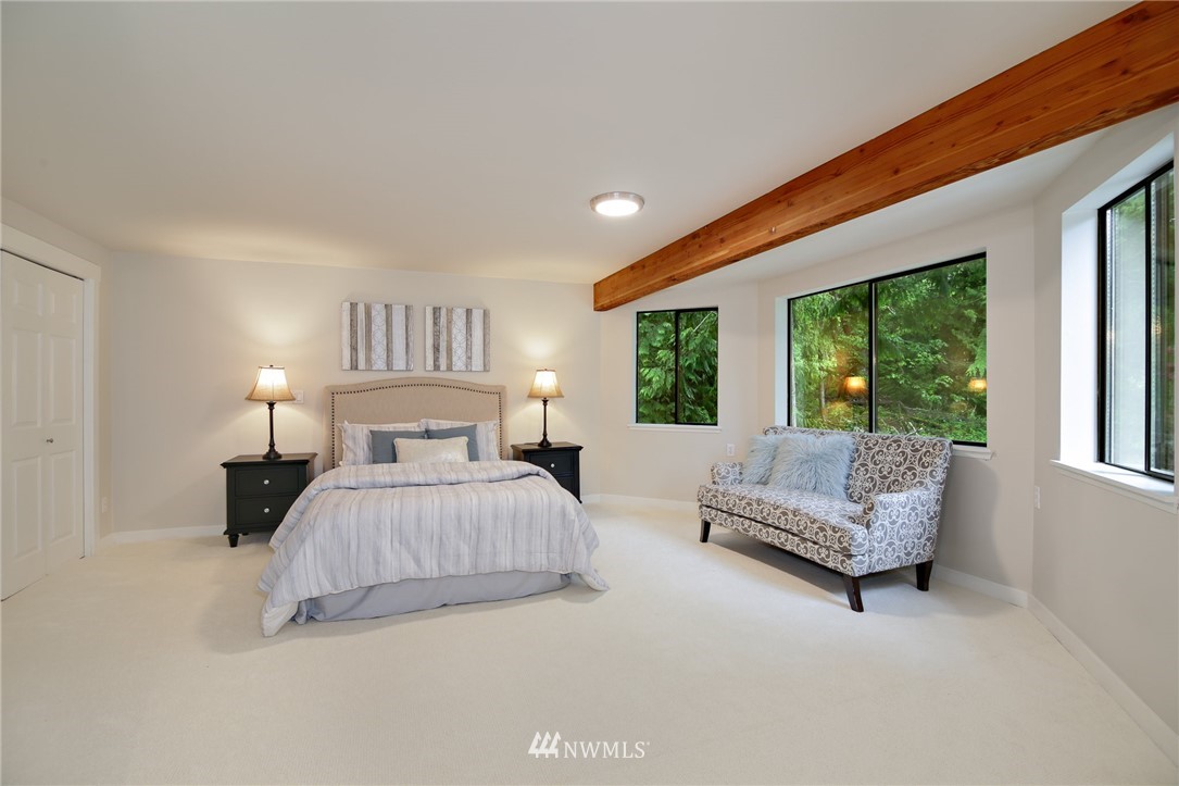 28505 Northeast Tolt Hill Road Carnation, WA 98014 - Photo 20 of 25 a spacious bedroom with a bed and a large window