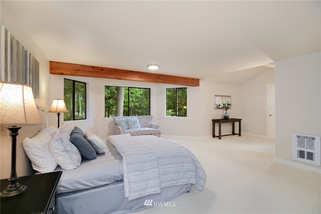 28505 Northeast Tolt Hill Road Carnation, WA 98014 - Photo 21 of 25 a bed room with a bed and a table