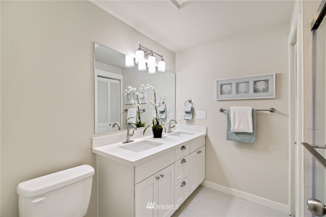 28505 Northeast Tolt Hill Road Carnation, WA 98014 - Photo 22 of 25 a bathroom with a toilet sink and mirror