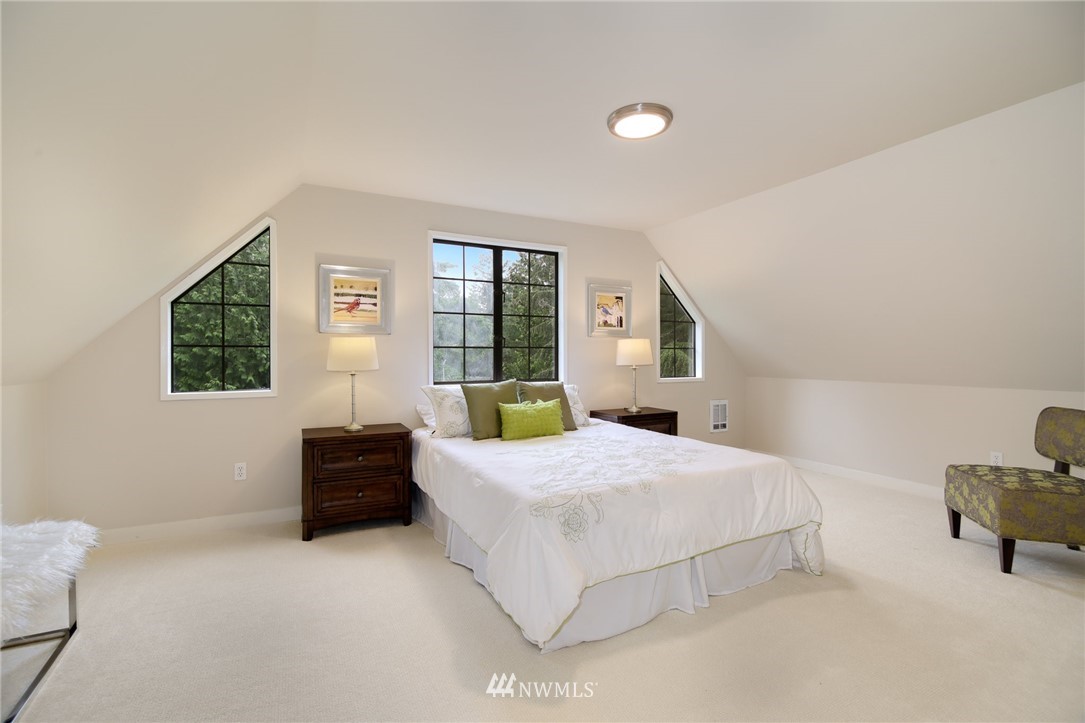 28505 Northeast Tolt Hill Road Carnation, WA 98014 - Photo 23 of 25 a bedroom with a bed and a couch