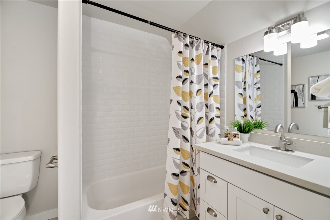 28505 Northeast Tolt Hill Road Carnation, WA 98014 - Photo 24 of 25 a bathroom with a sink and a mirror