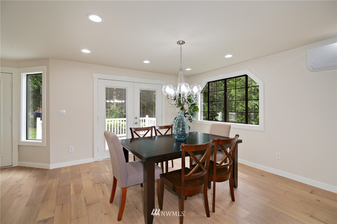 28505 Northeast Tolt Hill Road Carnation, WA 98014 - Photo 9 of 25 a view of a dining room with furniture window and wooden floor