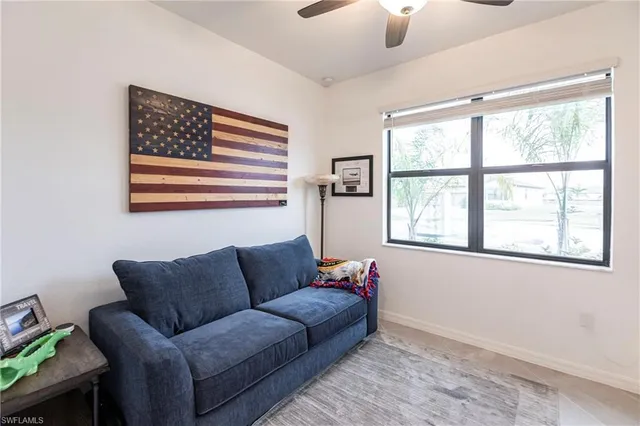 a living room with furniture and a window