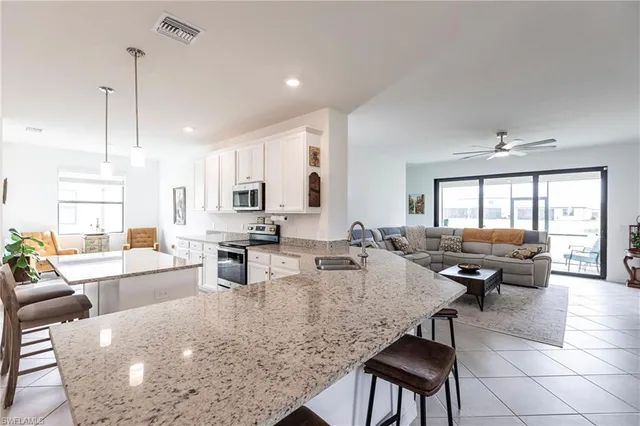 a large kitchen with a large window and counter space