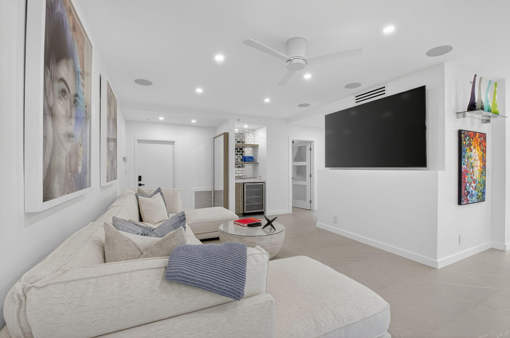7847 Lakeside Boulevard, Unit 1014 Boca Raton, FL 33434 - Photo 19 of 53 a living room with furniture and a flat screen tv