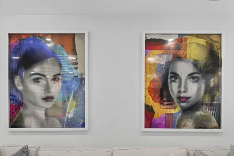 a bed room with a bed a television and a large window