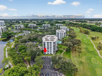 a view of a multi story building with a yard