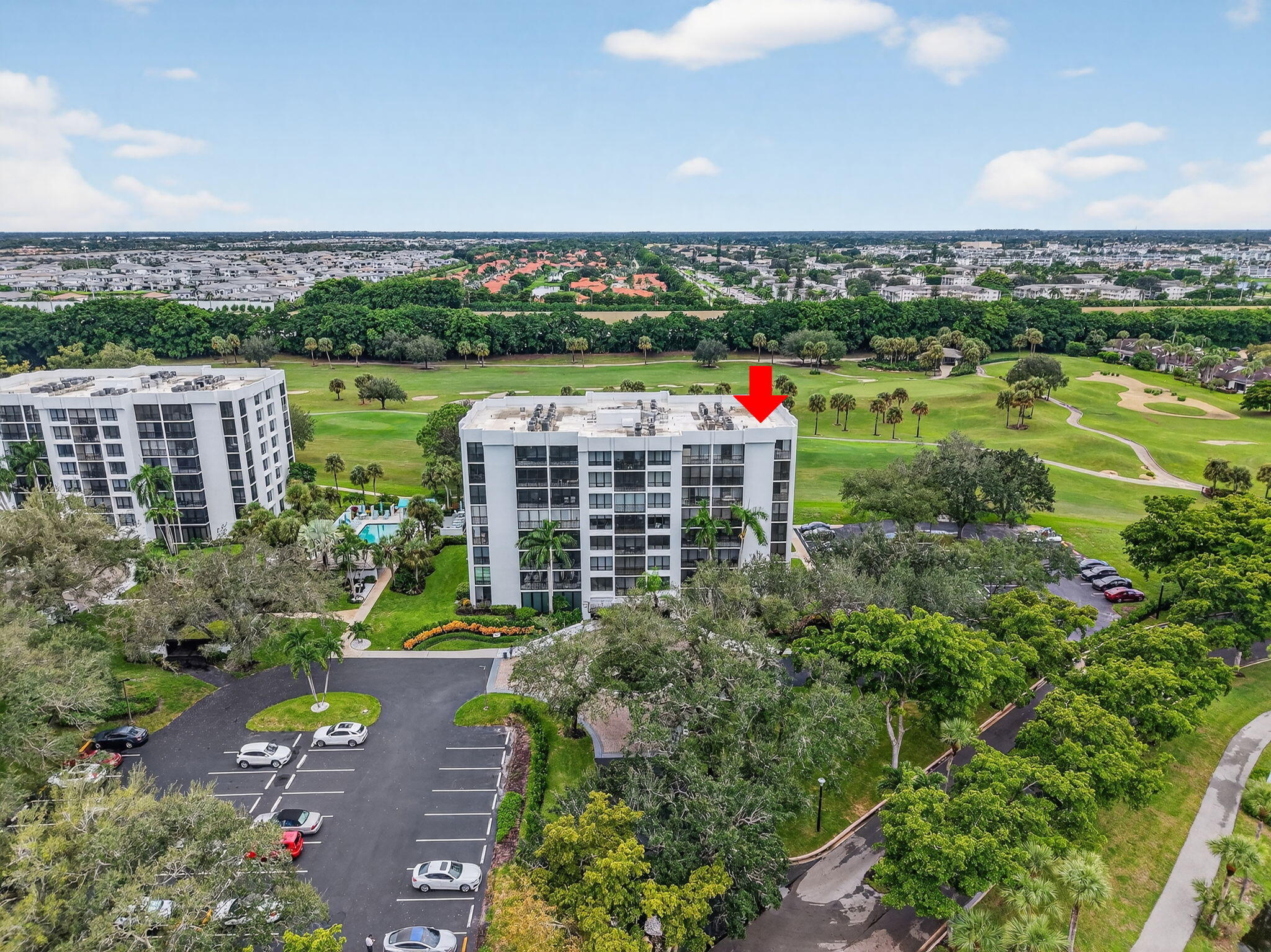 7847 Lakeside Boulevard, Unit 1014 Boca Raton, FL 33434 - Photo 35 of 53 a view of a multi story building with a yard