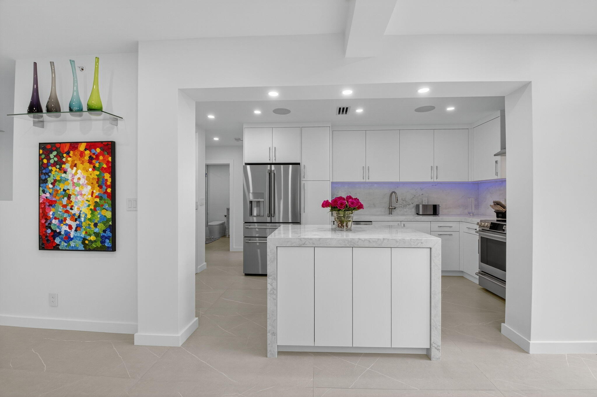 7847 Lakeside Boulevard, Unit 1014 Boca Raton, FL 33434 - Photo 8 of 53 a view of kitchen with kitchen island stainless steel appliances stove refrigerator and dining table