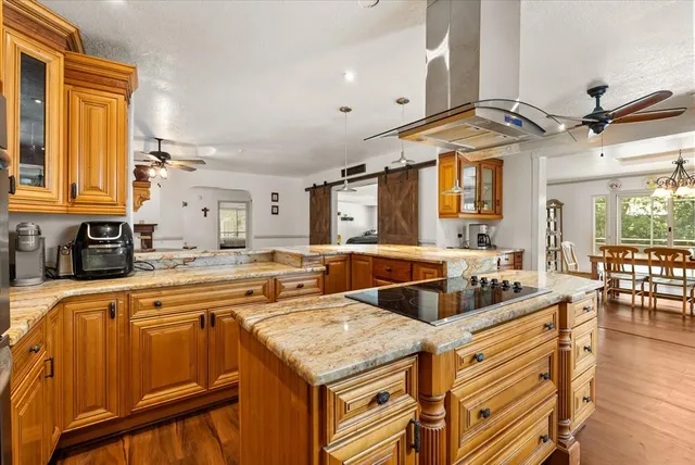 a kitchen with stainless steel appliances granite countertop a sink and cabinets