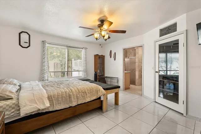 a bedroom with a bed and window