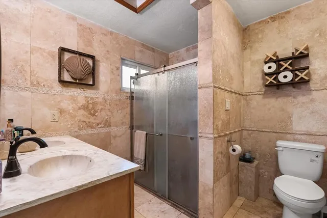 a bathroom with a sink toilet and vanity