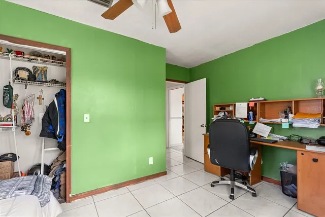 a view of a room with workspace and a window