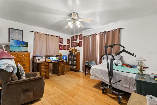a view of a livingroom with workspace and a window