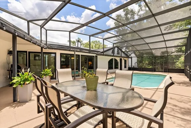 a view of a patio with a table and chairs