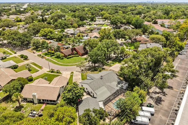 an aerial view of residential house with outdoor space and parking