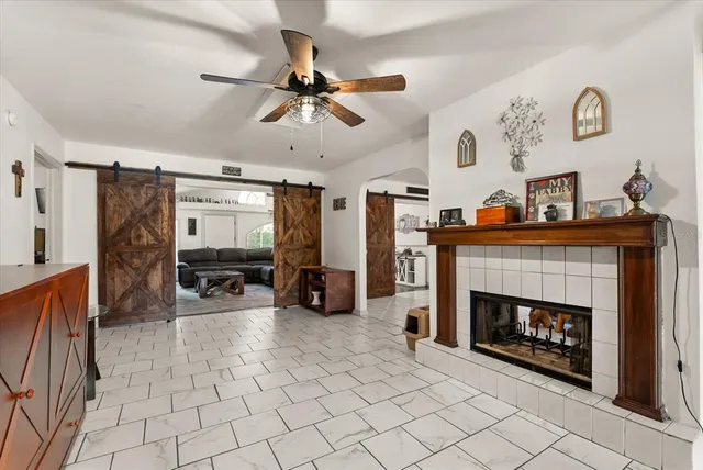 a living room with furniture and a fireplace