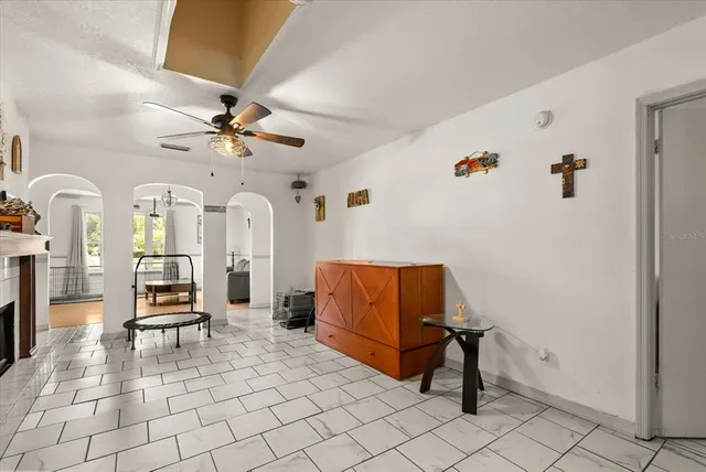 a living room with furniture and white walls