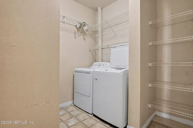 a utility room with dryer and washer