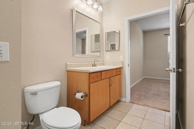 a view of a lake with houses in the back