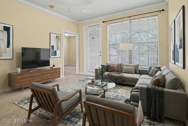 a living room with furniture and a flat screen tv