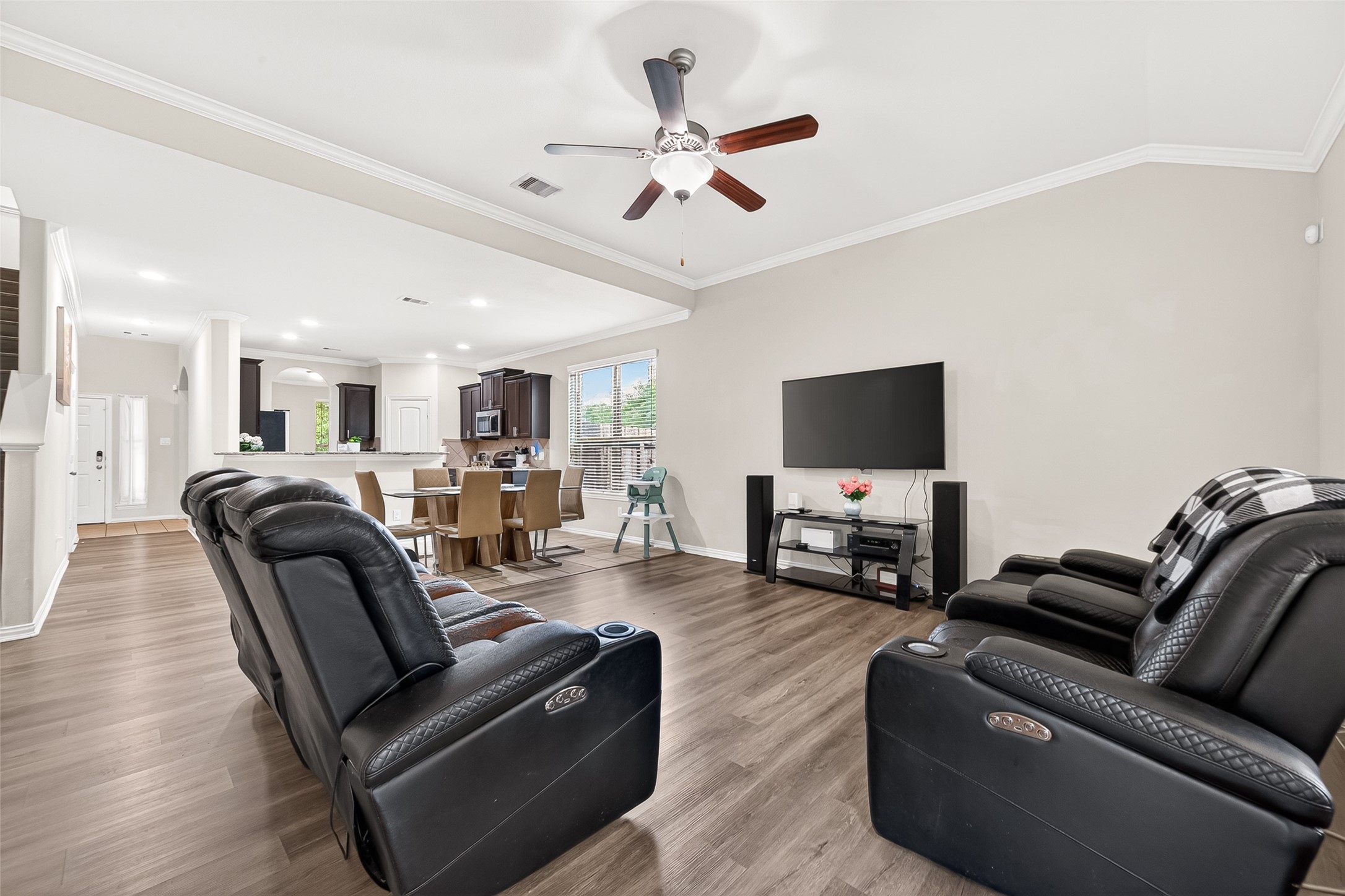 8 Landscape Court Conroe, TX 77301 - Photo 11 of 43 a living room with furniture and a flat screen tv