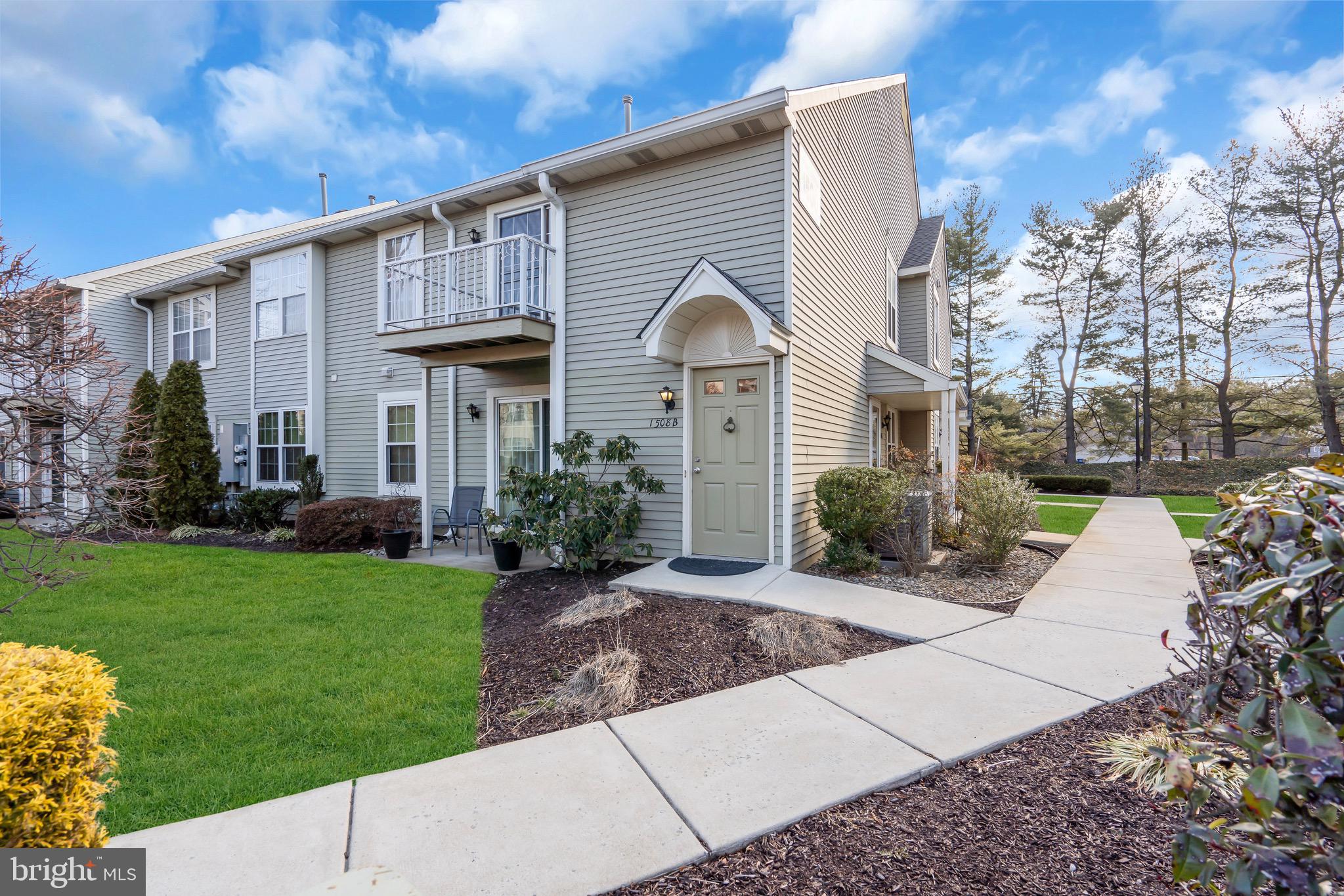 1508 B Ralston Drive Mount Laurel, NJ 08054 - Photo 1 of 29 a front view of a house with a garden