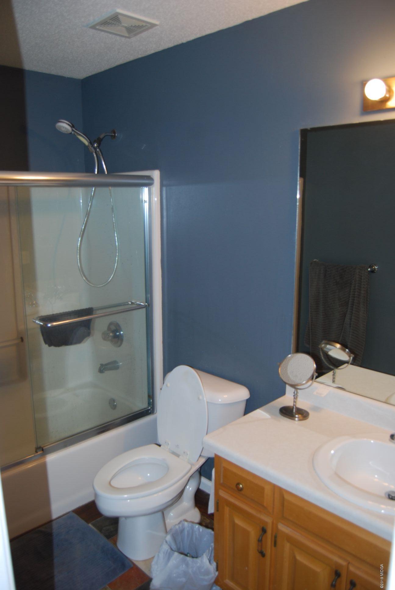 113 Marcar Road Macon, GA 31216 - Photo 13 of 31 a bathroom with a sink toilet and shower