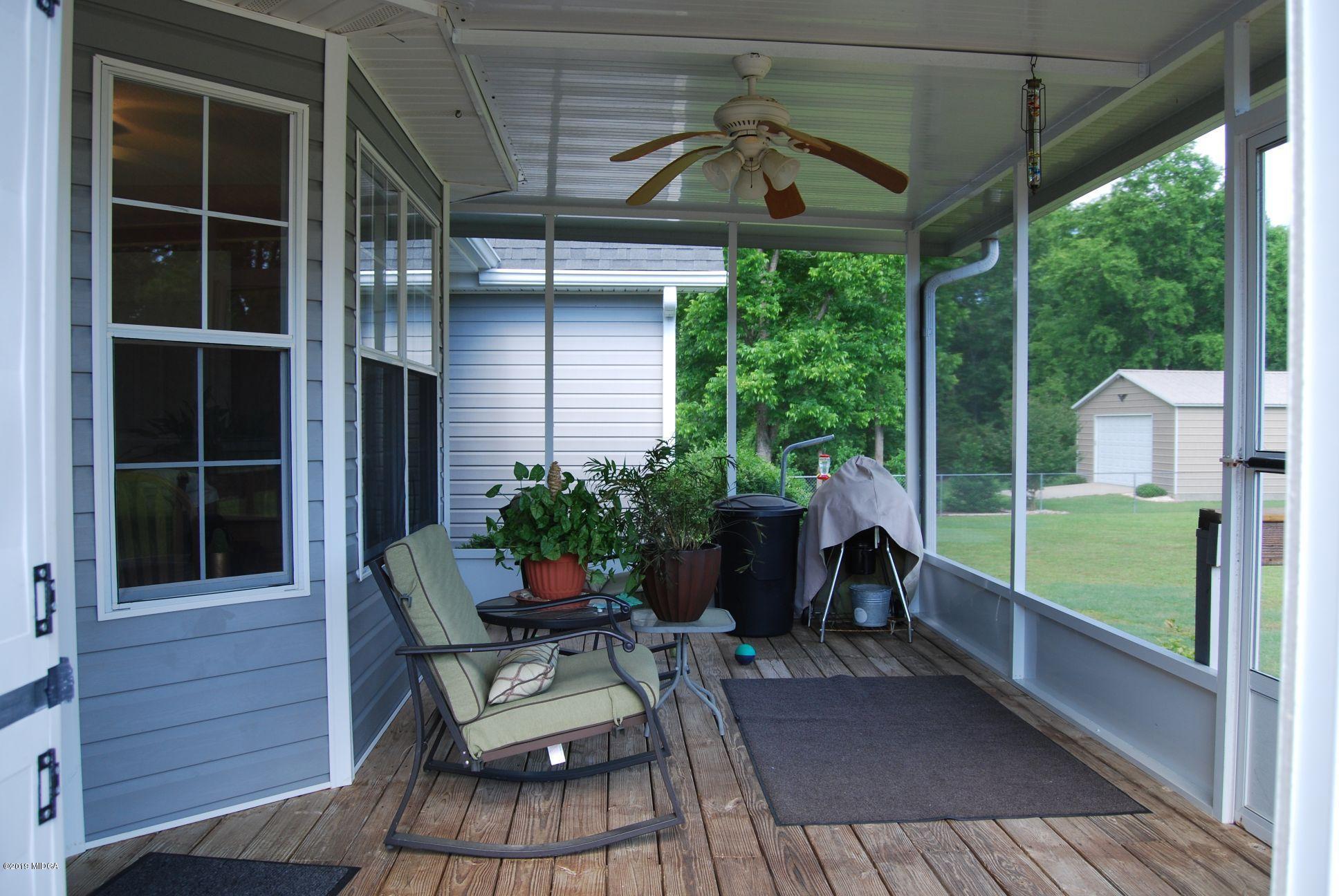 113 Marcar Road Macon, GA 31216 - Photo 21 of 31 a view of balcony with furniture and garden